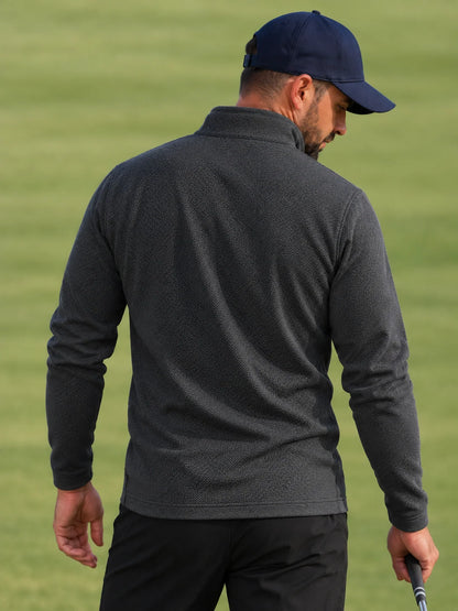 Golf-Pullover aus Funktionsmaterial in Anthrazitgrau mit feiner Mikrorippstruktur und Viertelreißverschluss