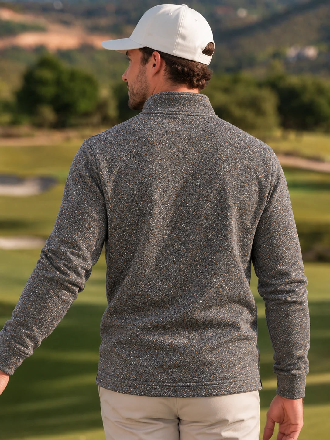 Golf-Pullover mit Viertelreißverschluss und Donegal-Tweed-Muster in meliertem Grau